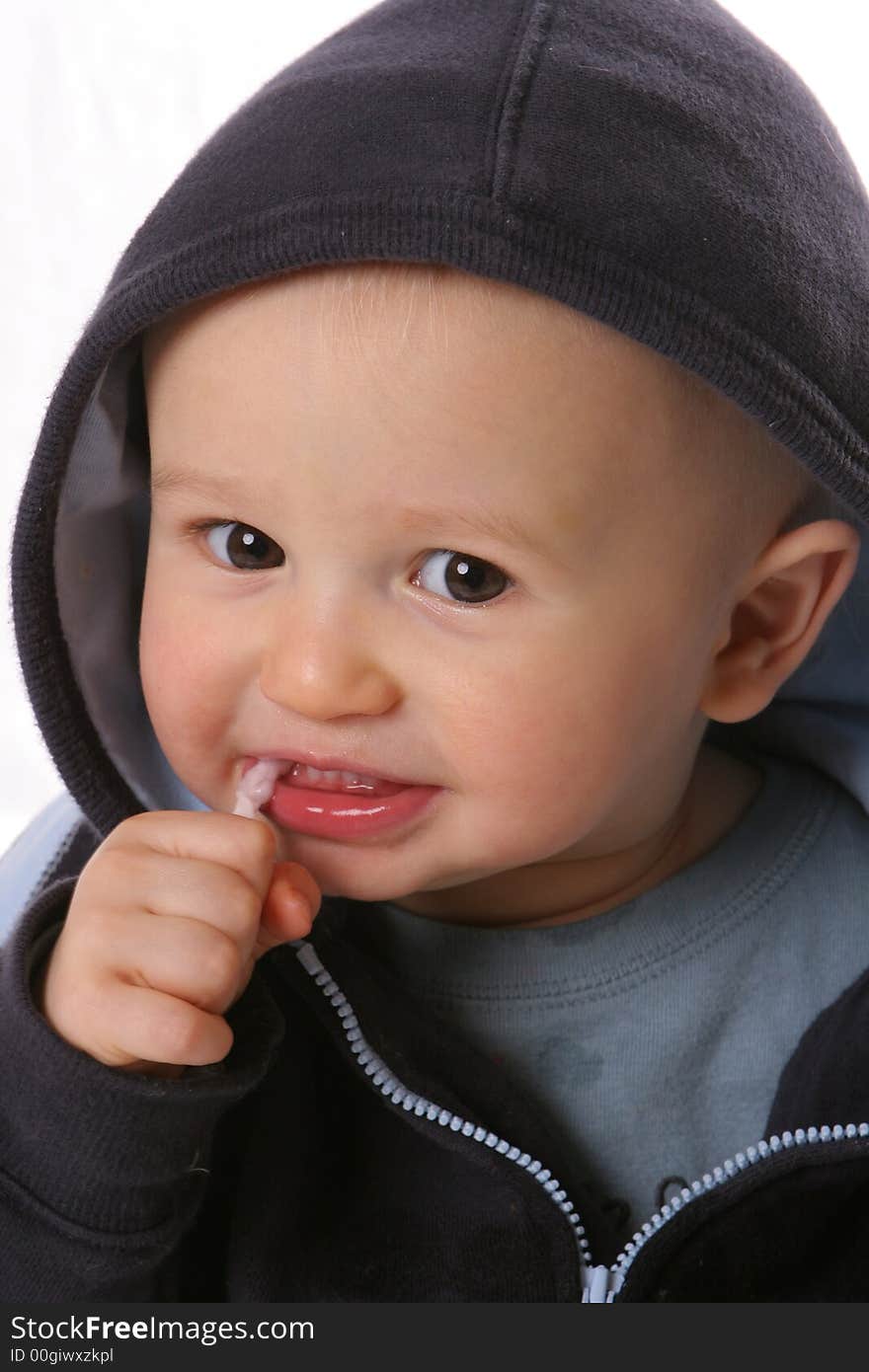 Toddler with sucker blue jacket. Toddler with sucker blue jacket