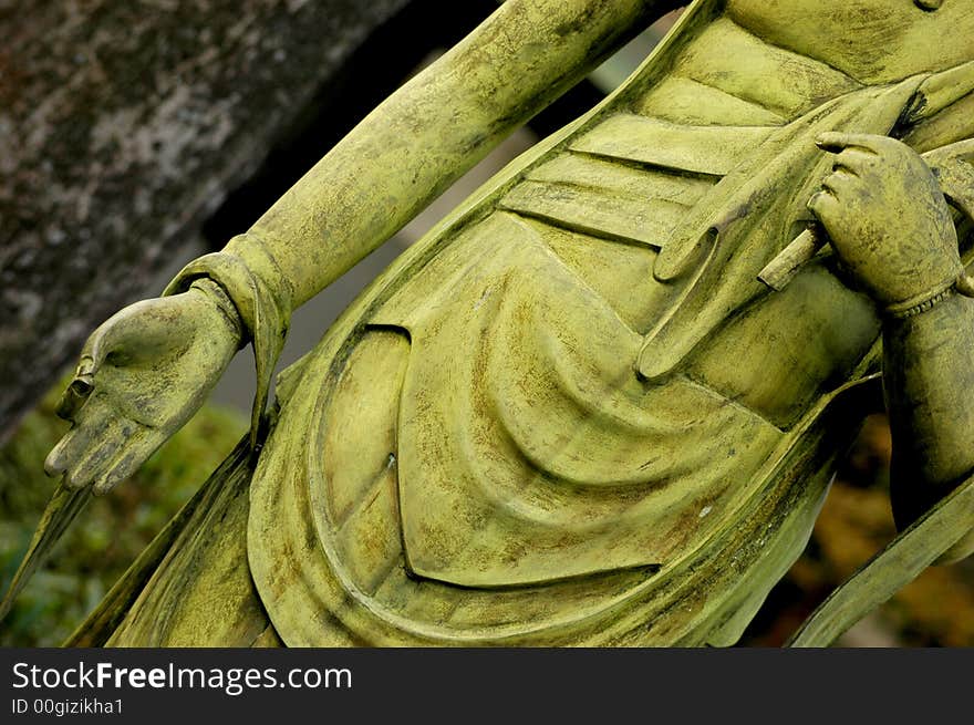 A vibrant grassy green statue of Buddha at the Toganji temple in Nagoya Japan. A vibrant grassy green statue of Buddha at the Toganji temple in Nagoya Japan.