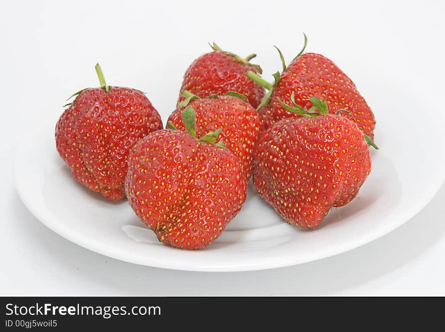 Strawberries on the plate isolated