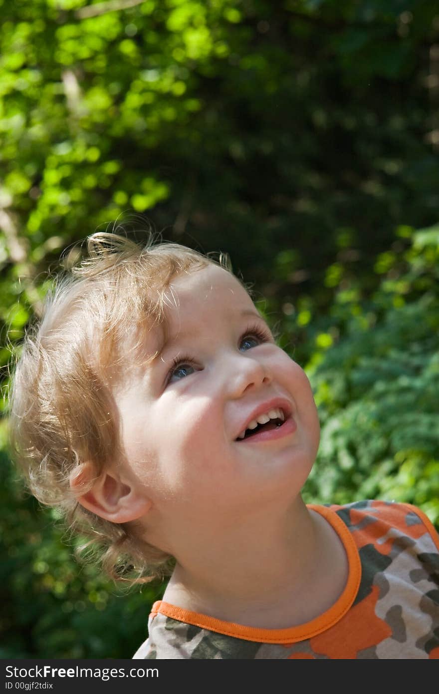 Admired and surprised boy on walk in a scaffold in a sunny day