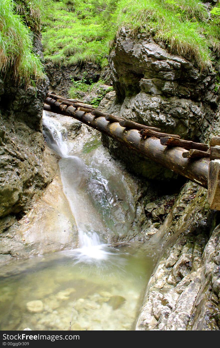 Small bridge and waterfall