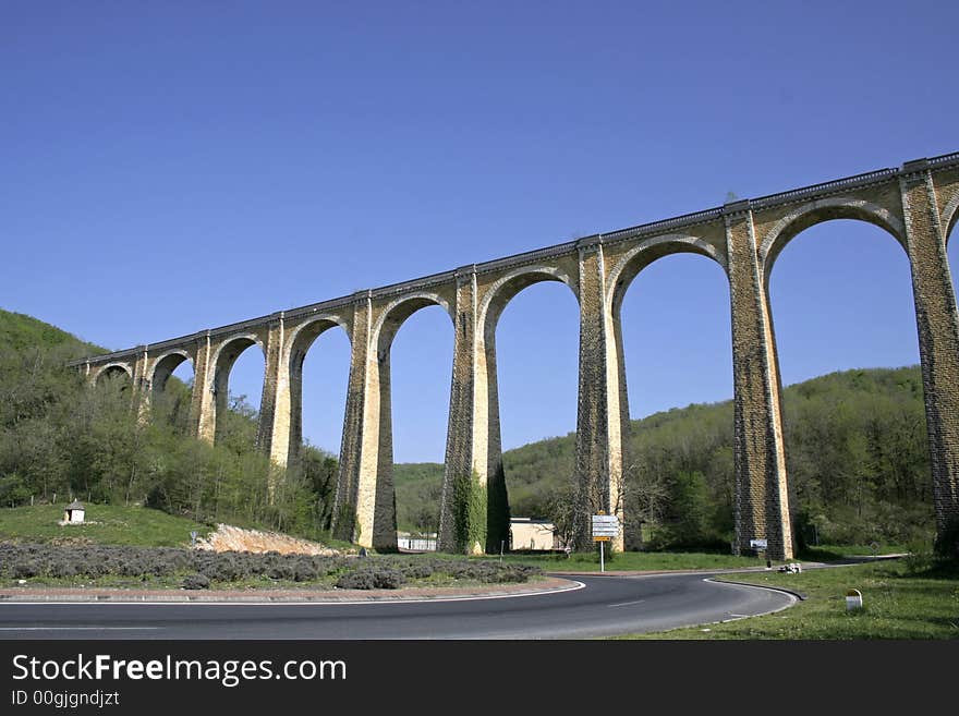 Large arch bridge on blue sky. Large arch bridge on blue sky