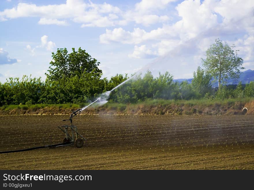 An hydrant irrigate a field in Umbria, Itlaly. An hydrant irrigate a field in Umbria, Itlaly.