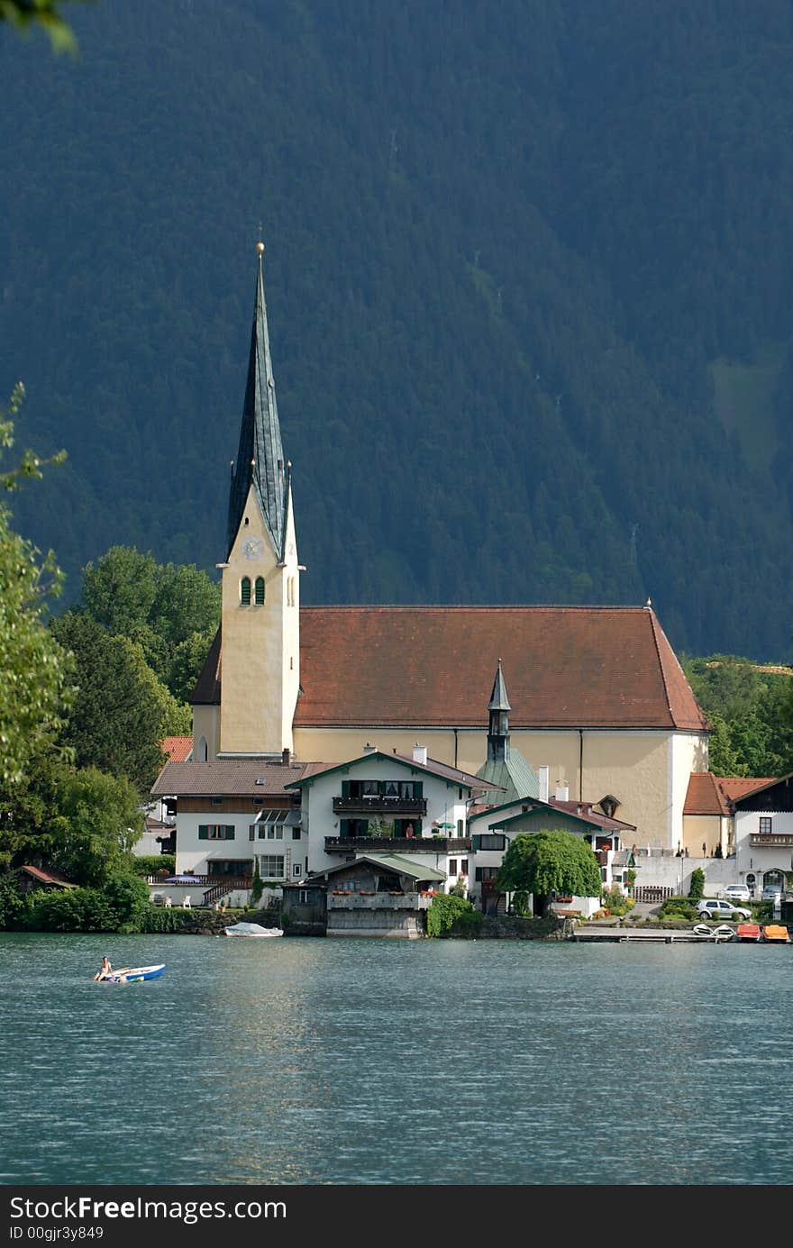 Alps lake with the church on the background. Alps lake with the church on the background