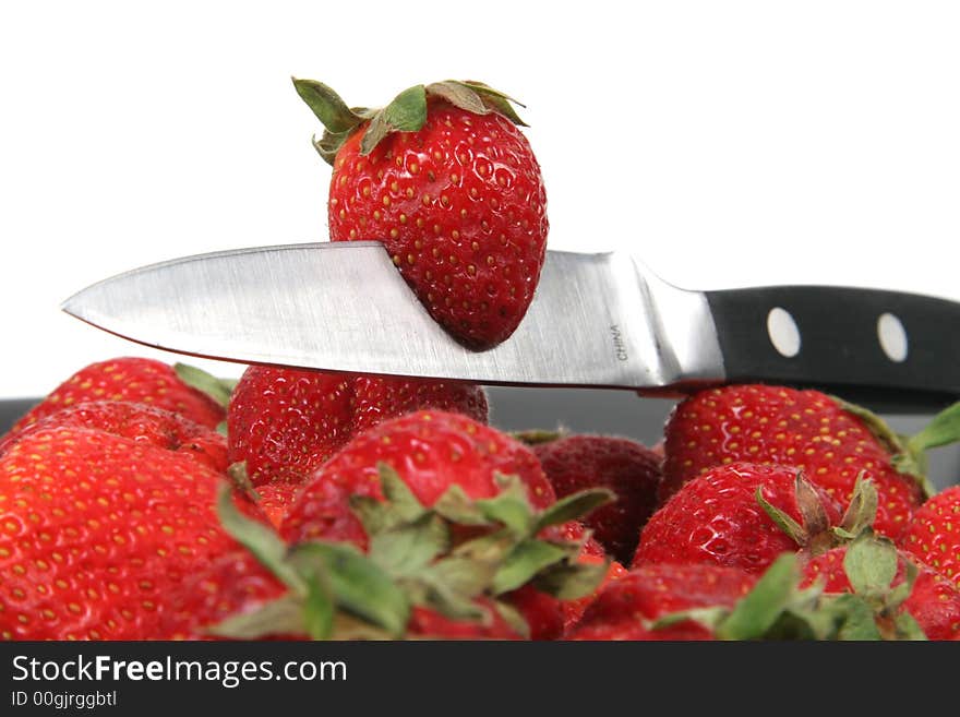 Strawberries with metal knife