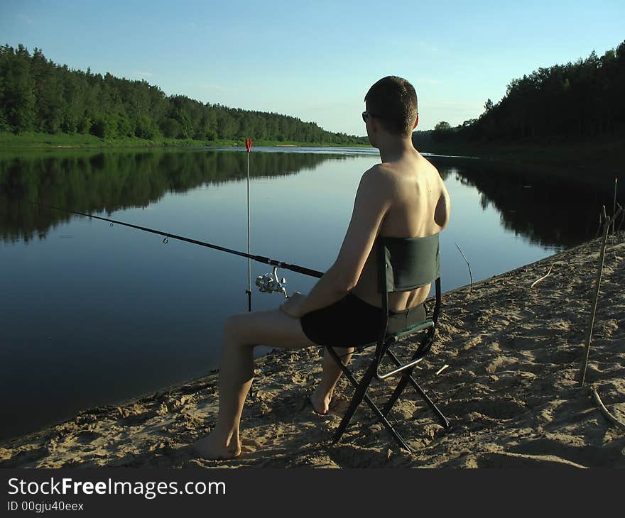 Fisherman at evening. Fine background!