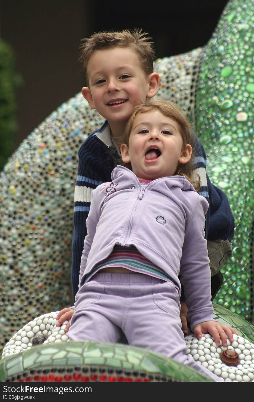 Brother and sister posing for a picture