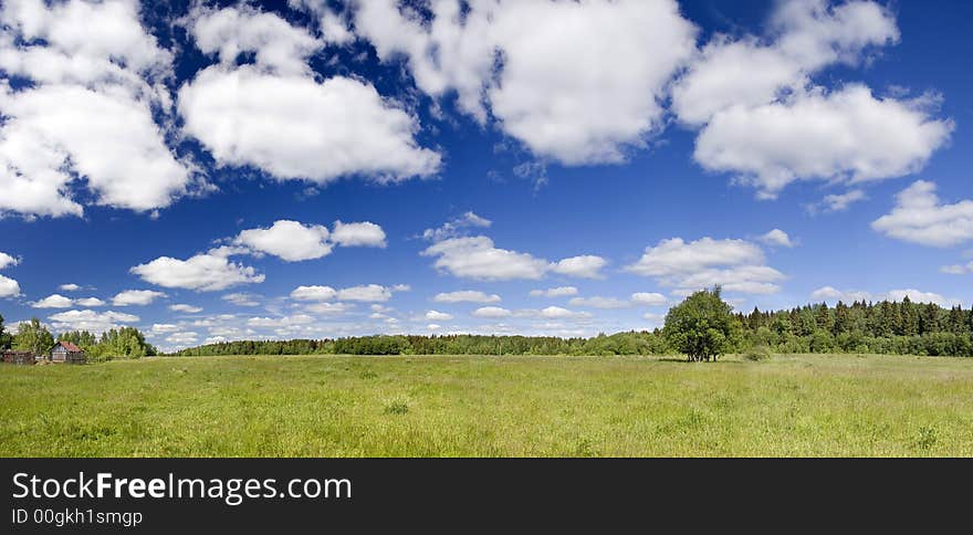 Panoramic photo of spring landscape with blue sky. Panoramic photo of spring landscape with blue sky