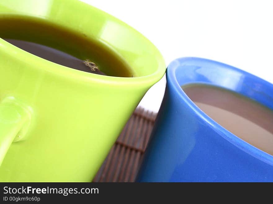 A beautiful cup on white background with coffee and tea. A beautiful cup on white background with coffee and tea