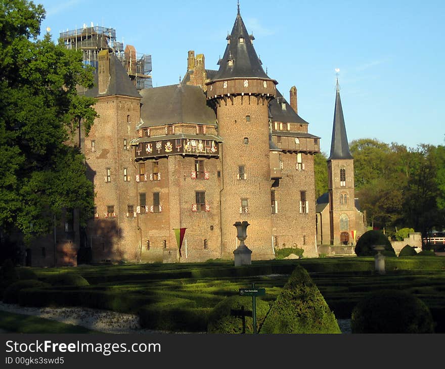 A castle with a garden in front of it