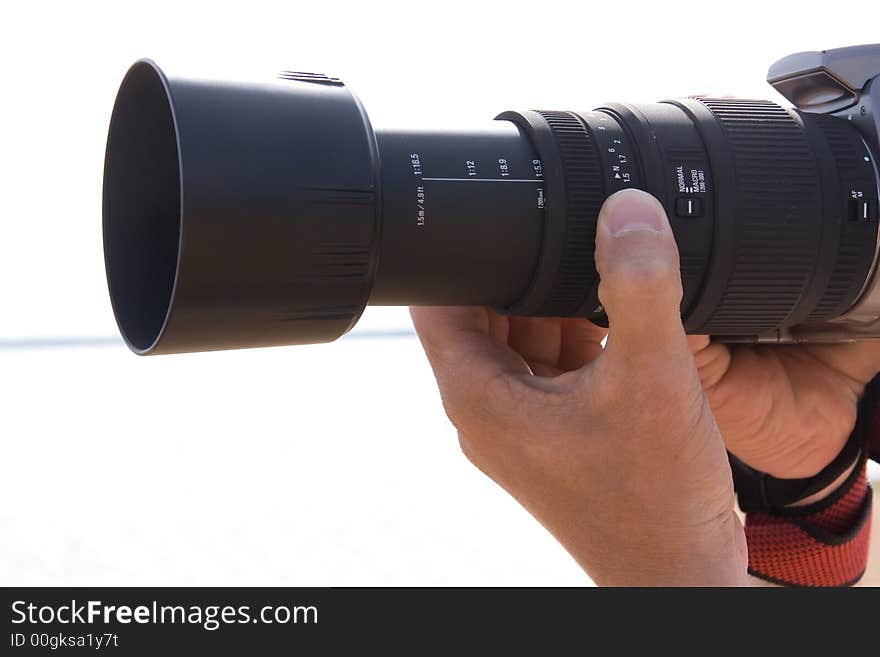 A photo of a man taking picture by a photocamera. A photo of a man taking picture by a photocamera