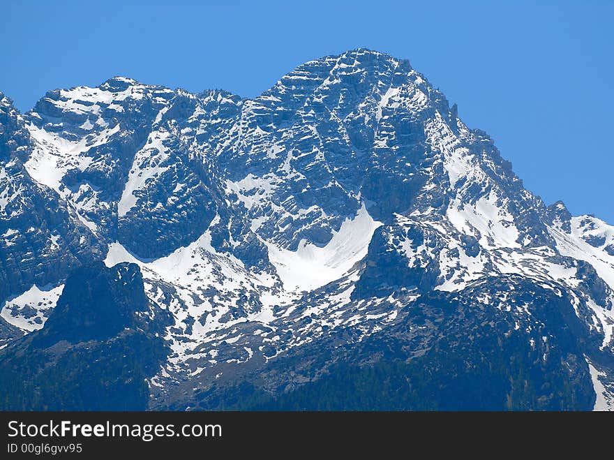 High Alps rock with snow on the top. High Alps rock with snow on the top