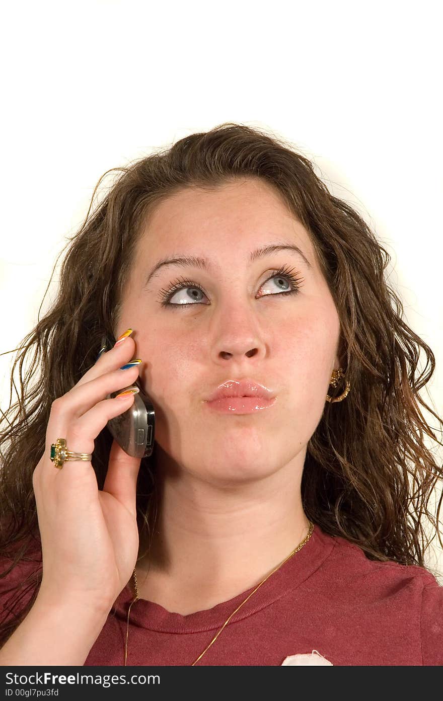 Teenage Caucasian girl on cell phone isoalted over white