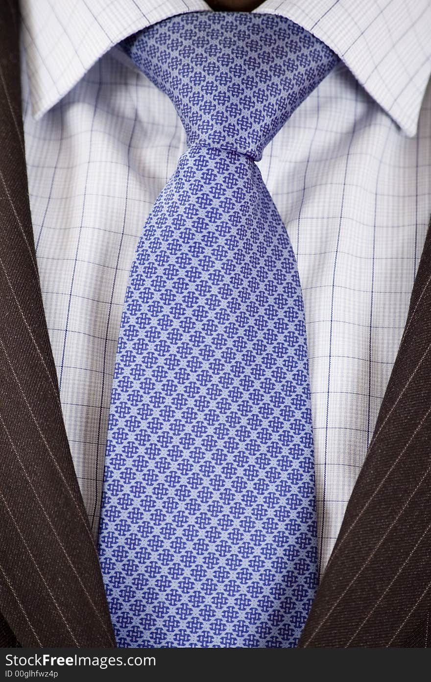 This is a close up of businessman wearing a tie, shirt, and suit. This is a close up of businessman wearing a tie, shirt, and suit.