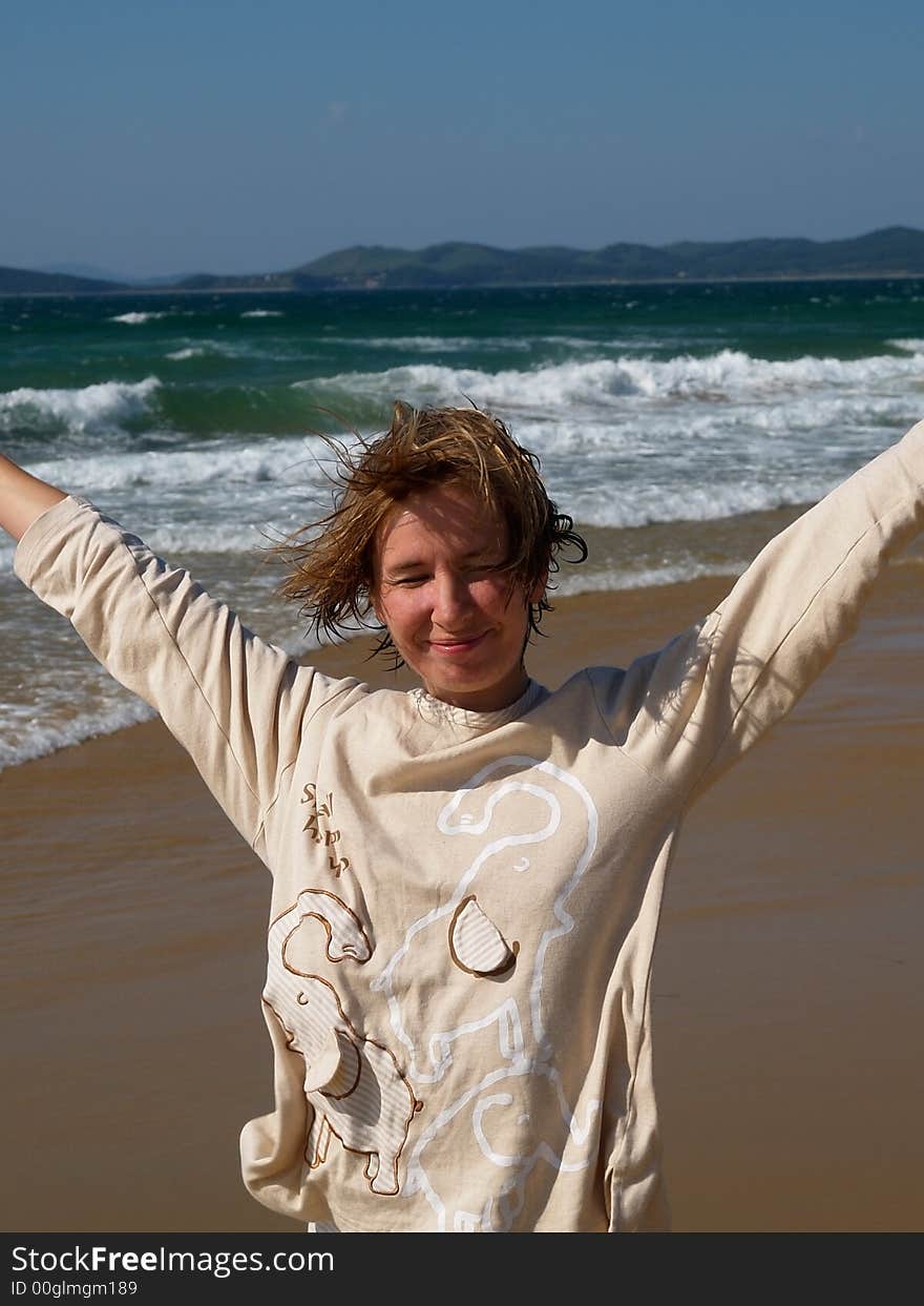 Happy Girl On The Beach