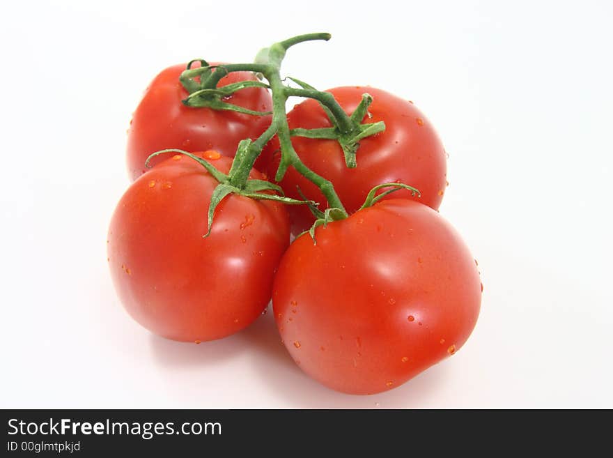 Red juicy tomatoes isolated