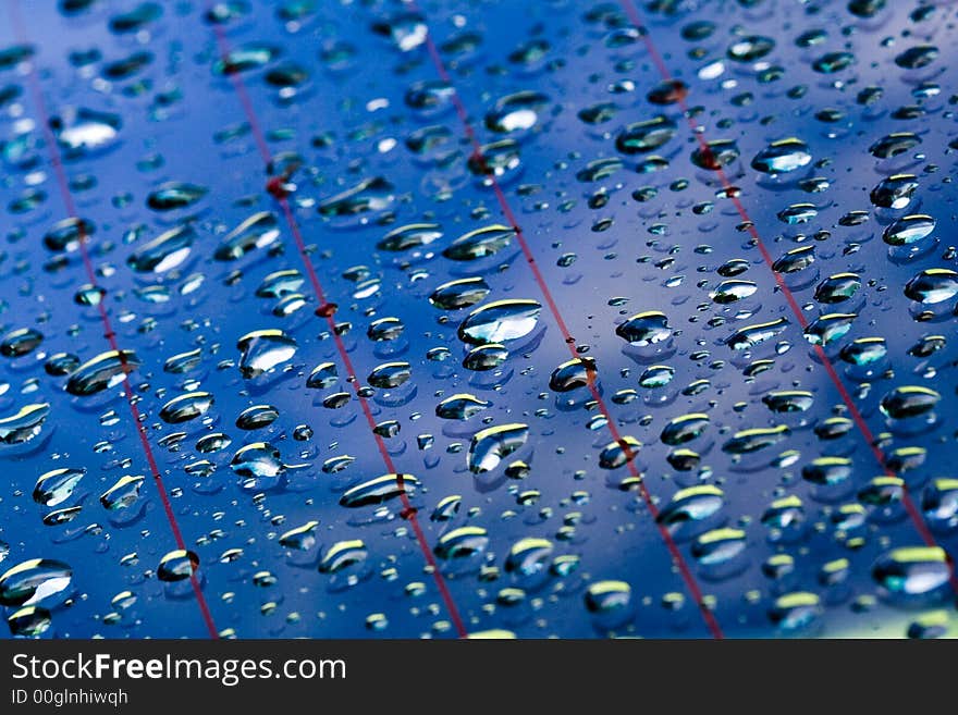 Water droplets in blue window surface. Water droplets in blue window surface