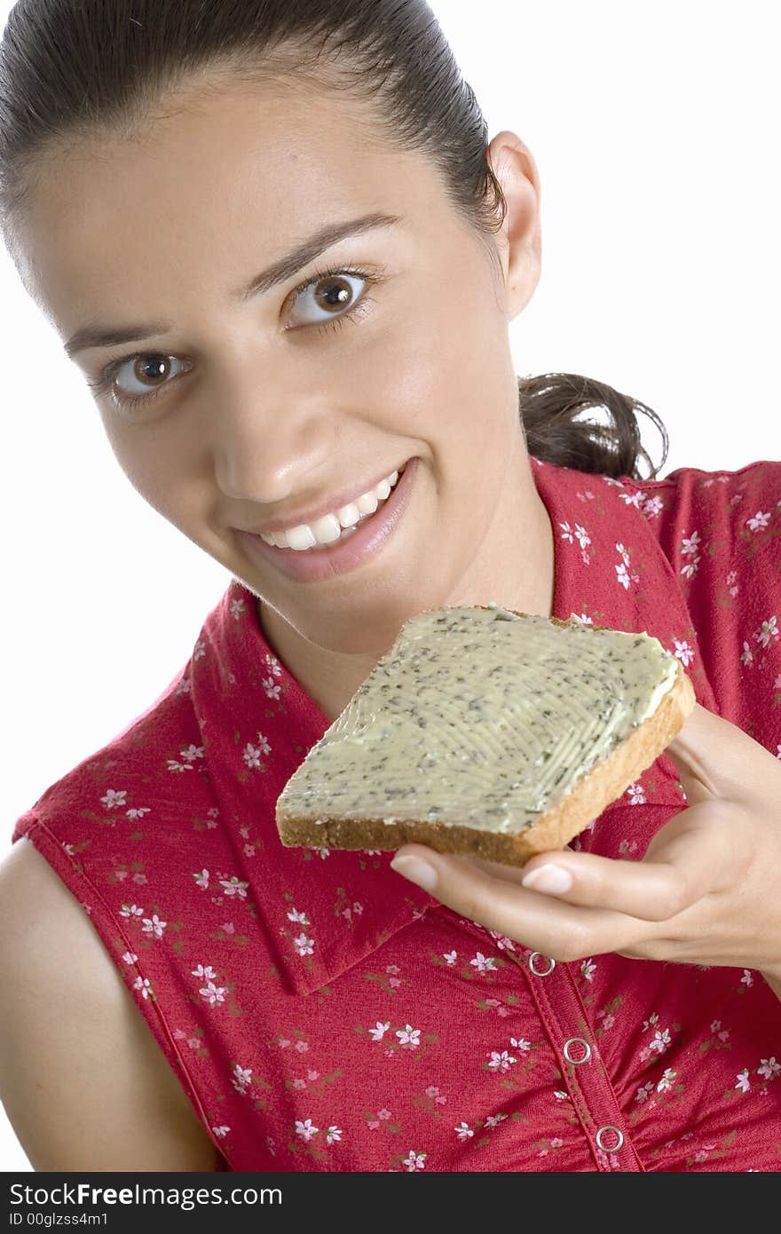 Woman eating slice of bread. Woman eating slice of bread