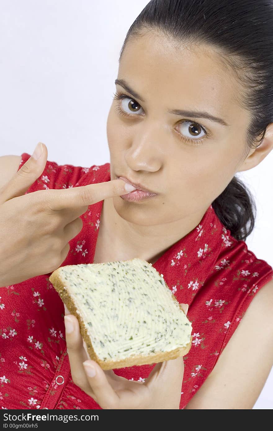 Woman eating slice of bread. Woman eating slice of bread