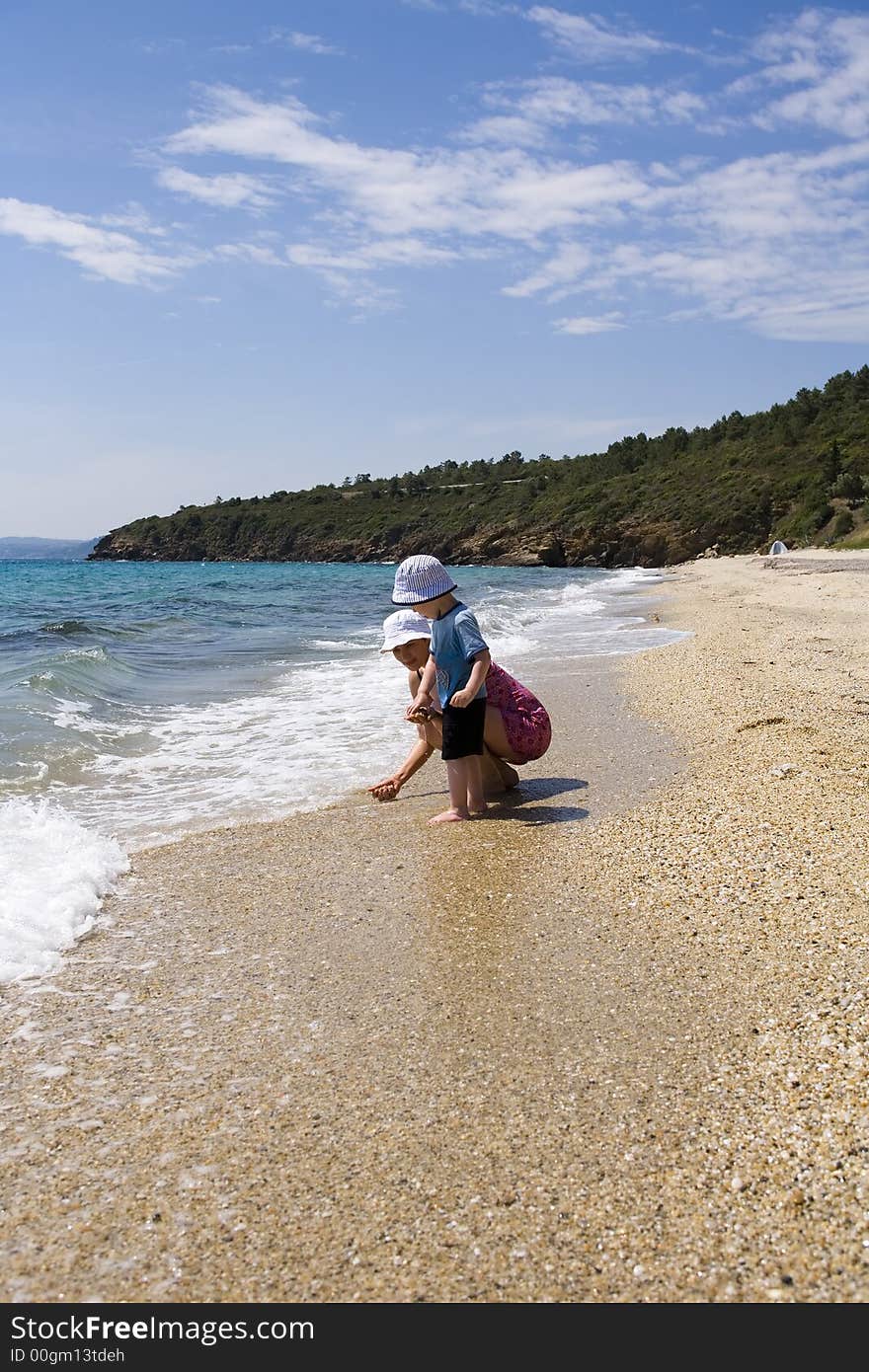 Ma with child on beach