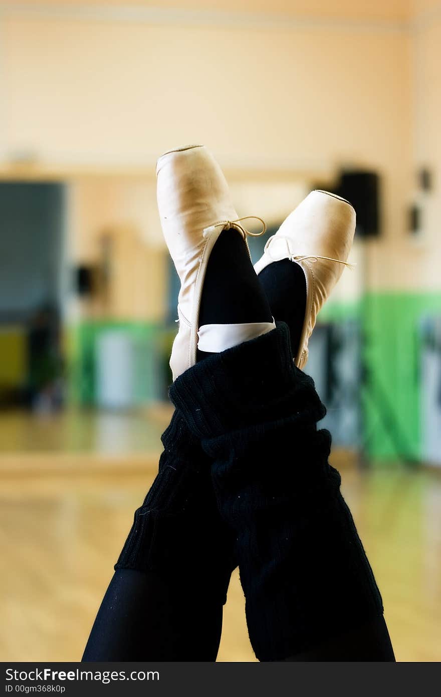 Ballet shoes on the legs in ballet position