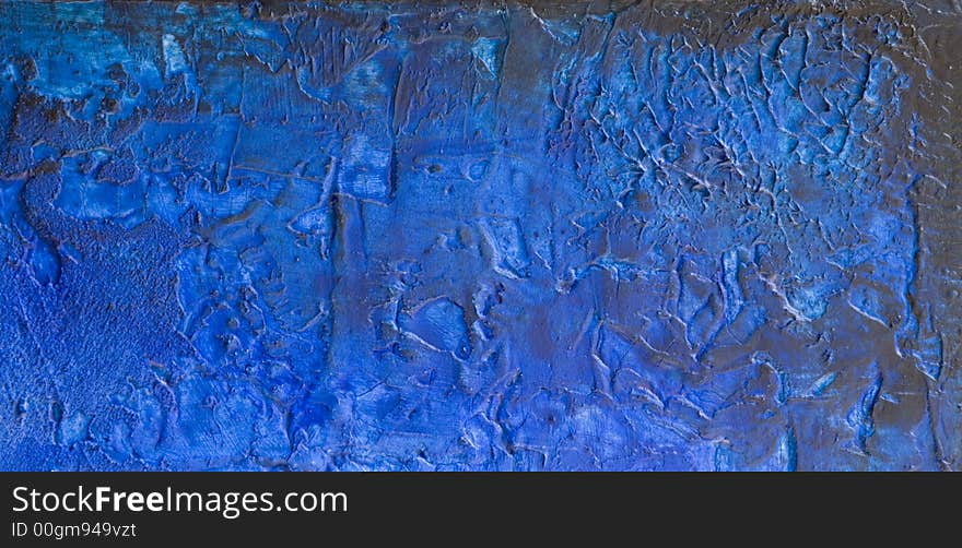 Word blue printed on abstract blue painting, painting was created by photographer