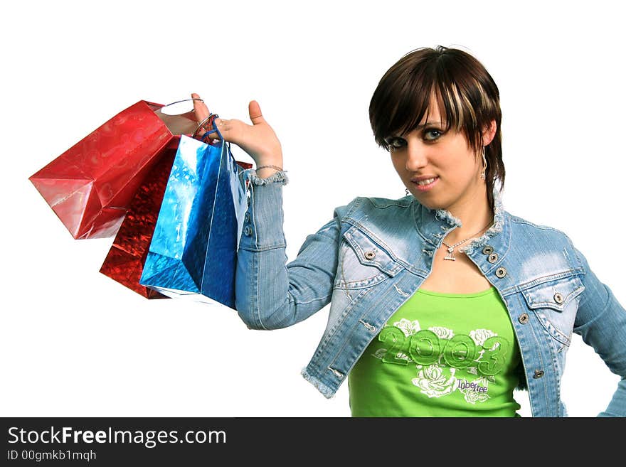 The happy girl with purchases, on a white background