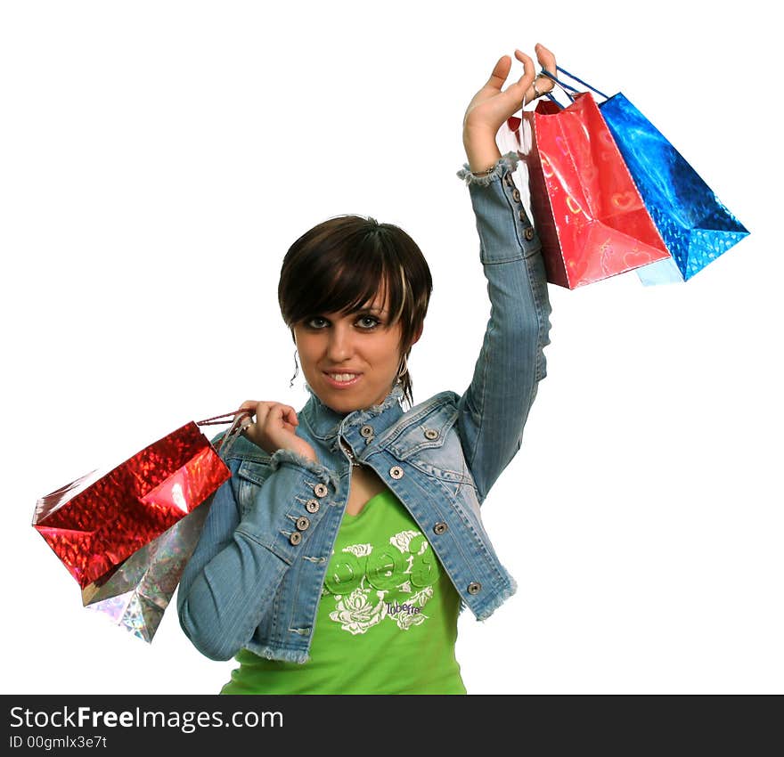 The happy girl with purchases, on a white background