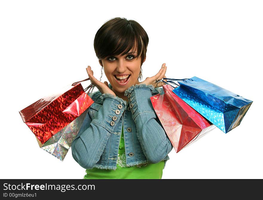 The happy girl with purchases, on a white background