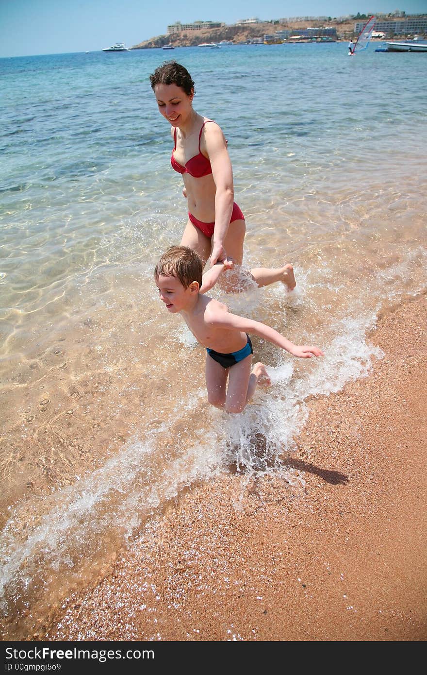 Woman with child on a sea