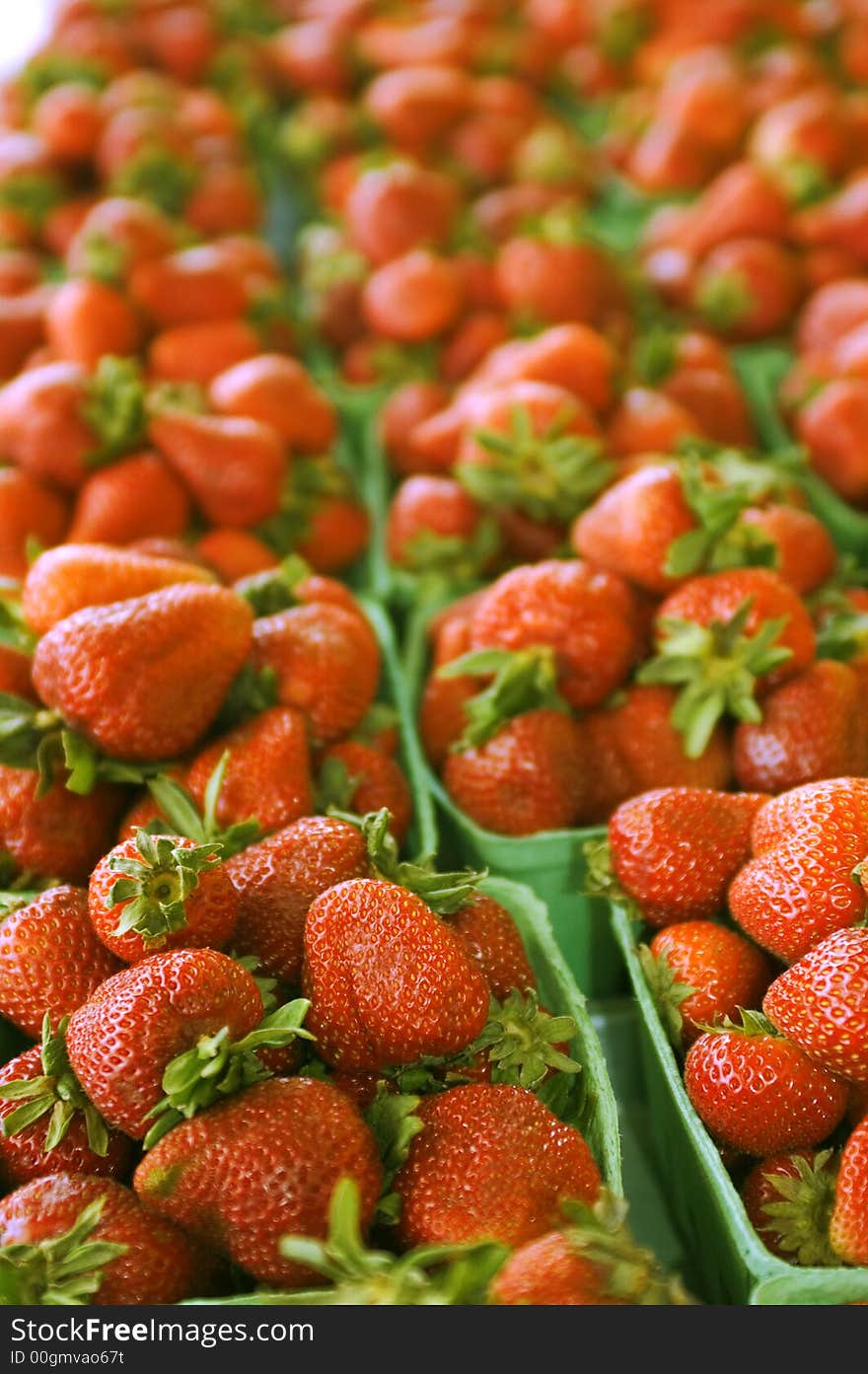 Spread out fresh strawberries for display. Spread out fresh strawberries for display.