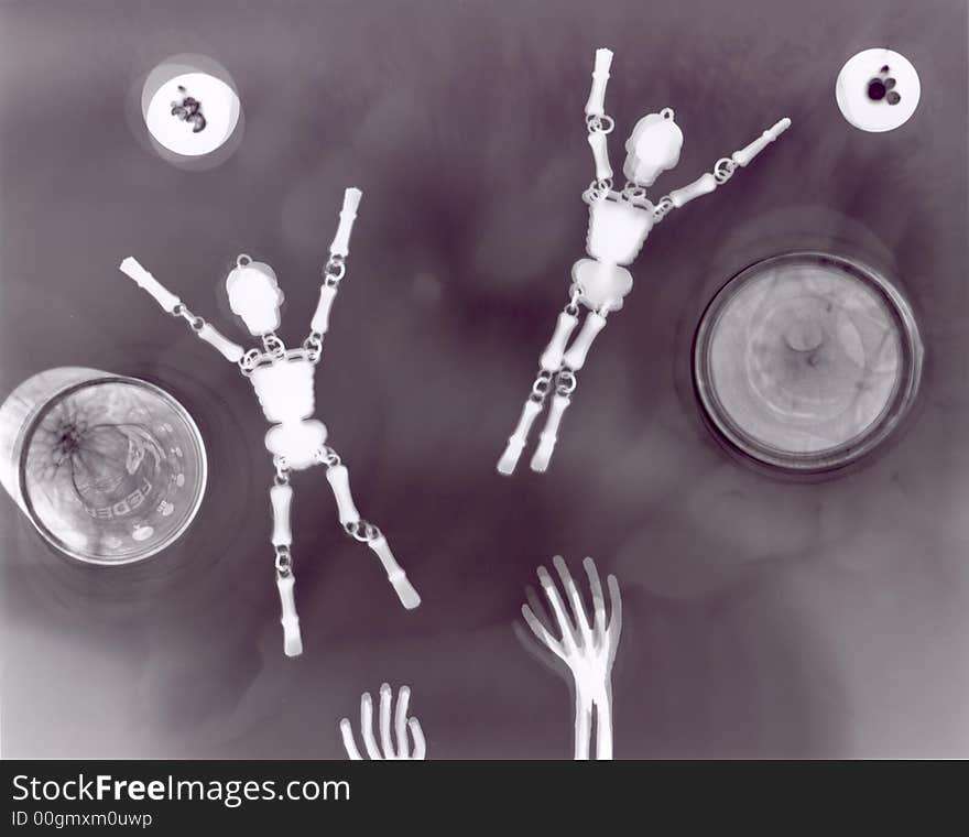 Photogram of jointed skeletons & scary bony hands. Photogram of jointed skeletons & scary bony hands.