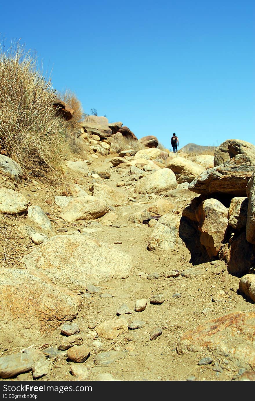 Trail this! Female hiker reached the top of the hill. Trail this! Female hiker reached the top of the hill.