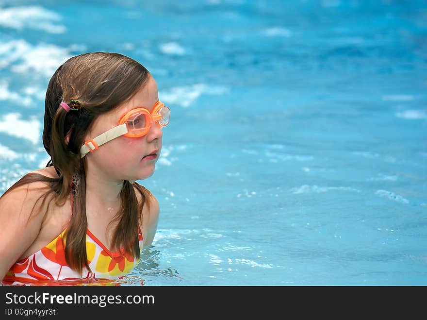 Girl swimming with goggles