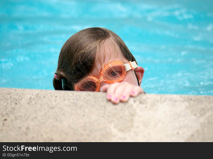 Girl swimming with goggles