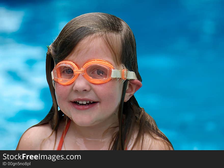 Girl swimming with goggles