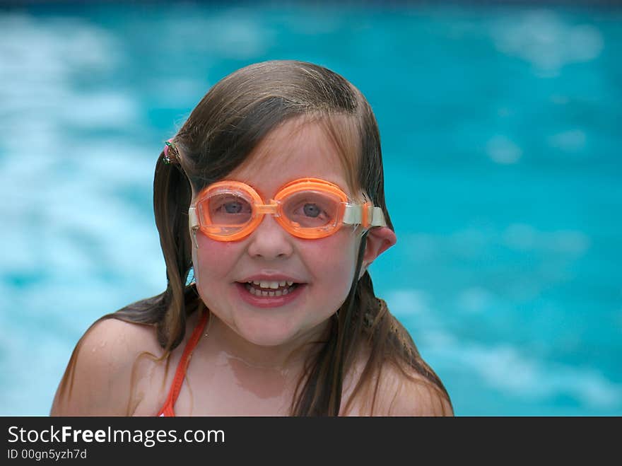 Girl swimming with goggles