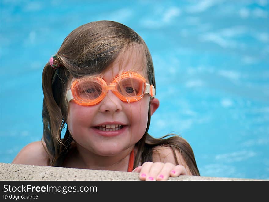 Girl swimming with goggles