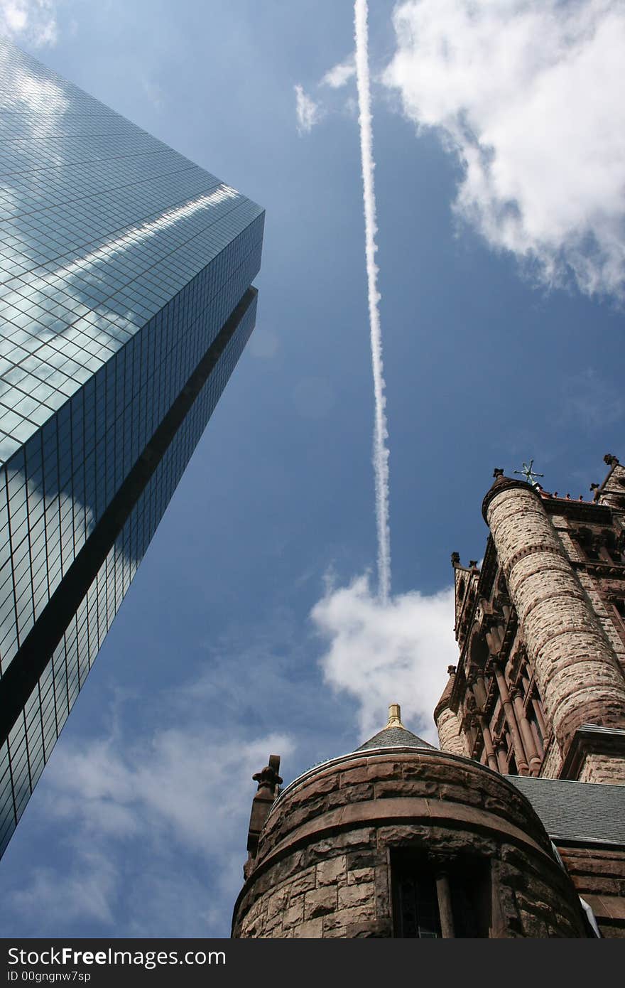 Between the John Hancock Building and Trinity Church. Between the John Hancock Building and Trinity Church.