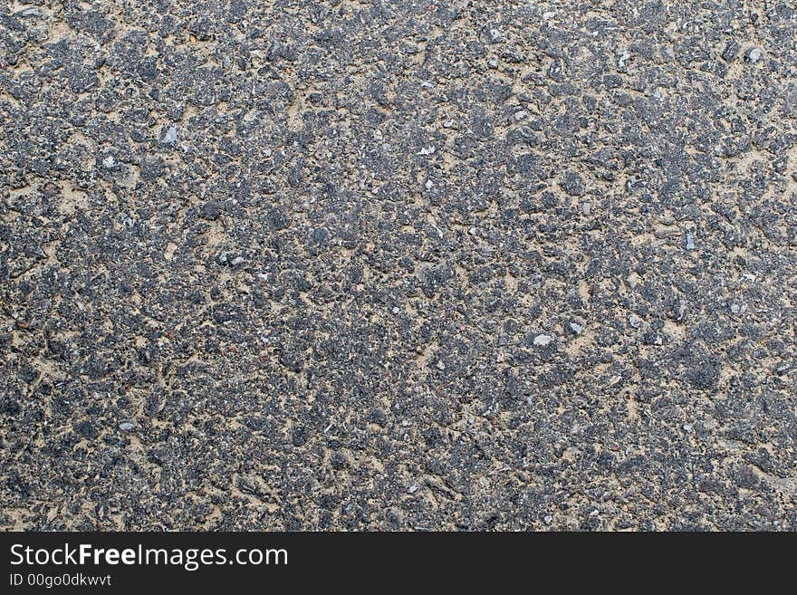 Sandy grey worn tarmac texture. Sandy grey worn tarmac texture