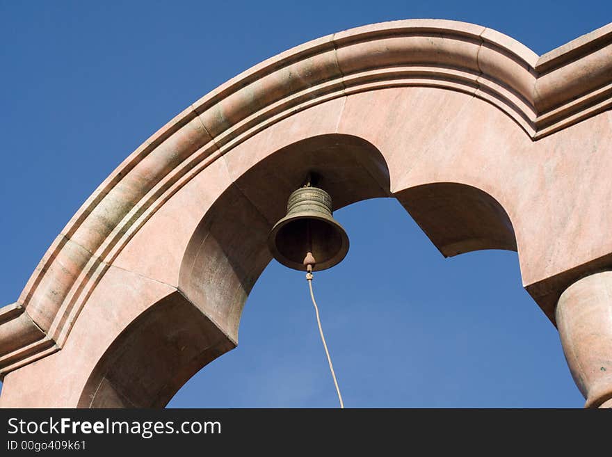 Church bell against clear blue sky