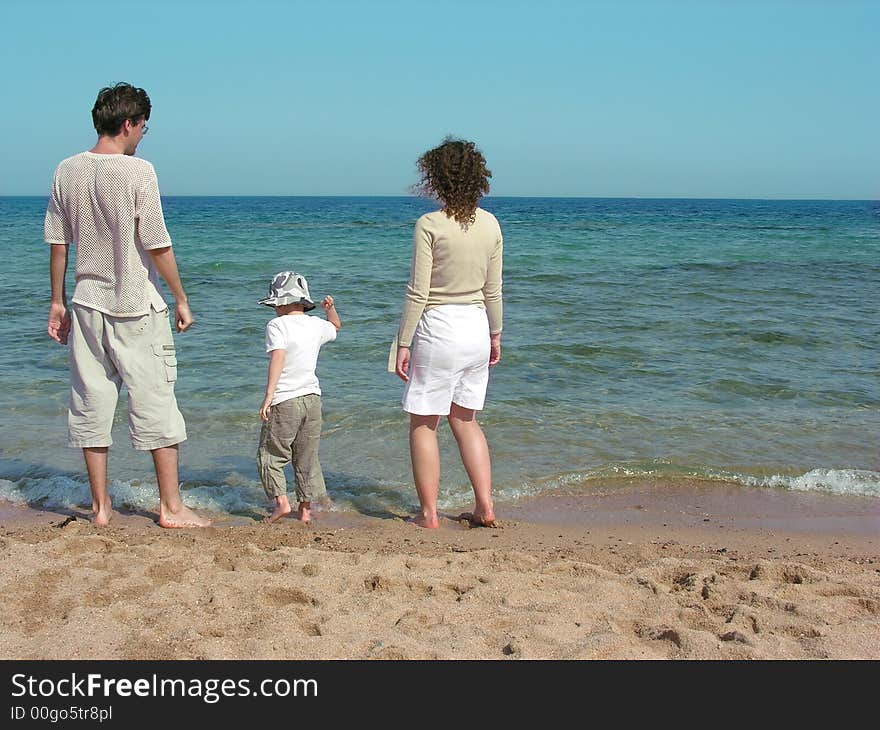 Family on a sand beach. Family on a sand beach