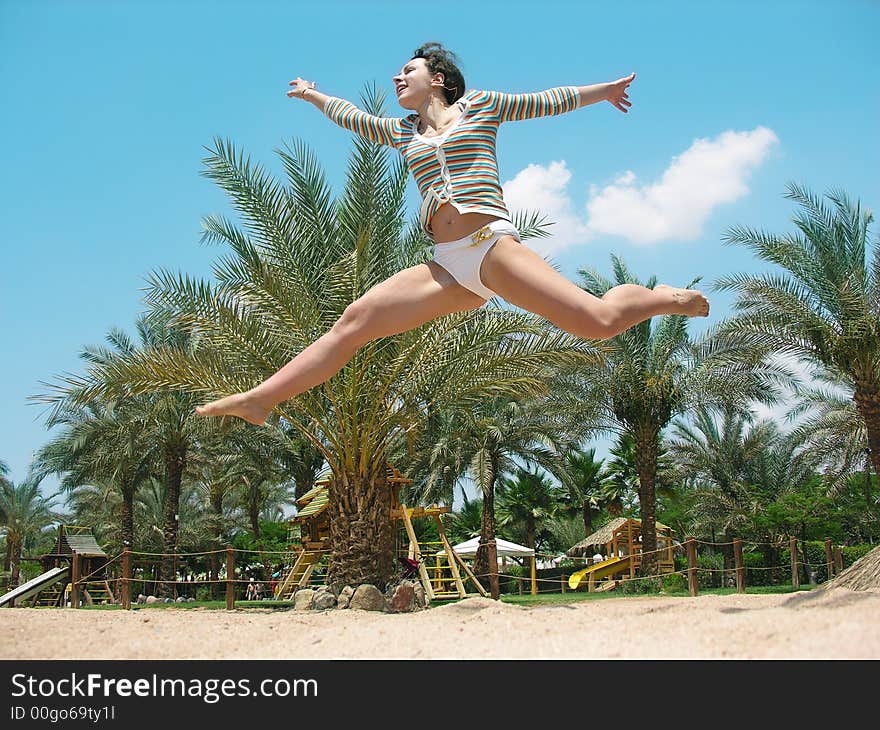 Girl  jumping on a beach