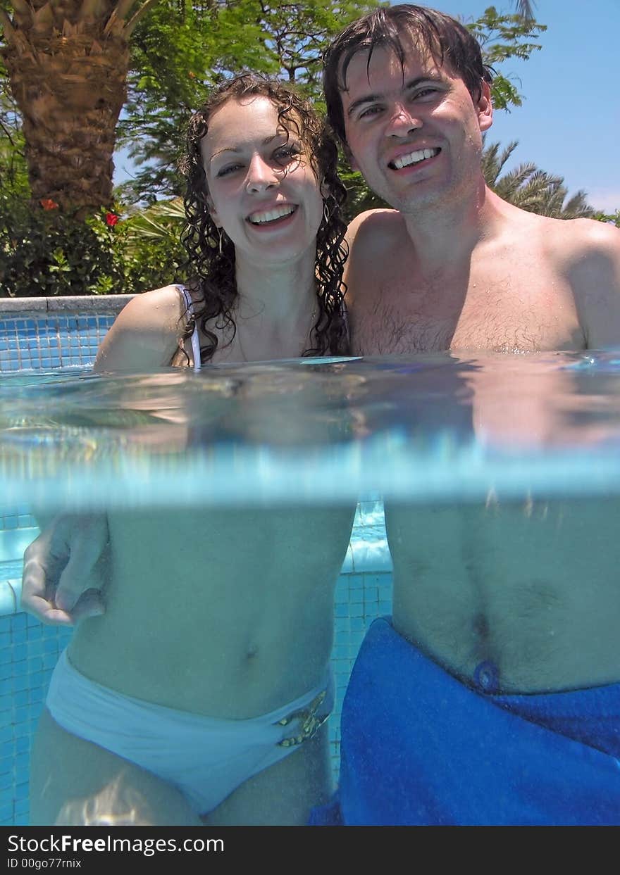 Man and woman in the swimming pool. Man and woman in the swimming pool