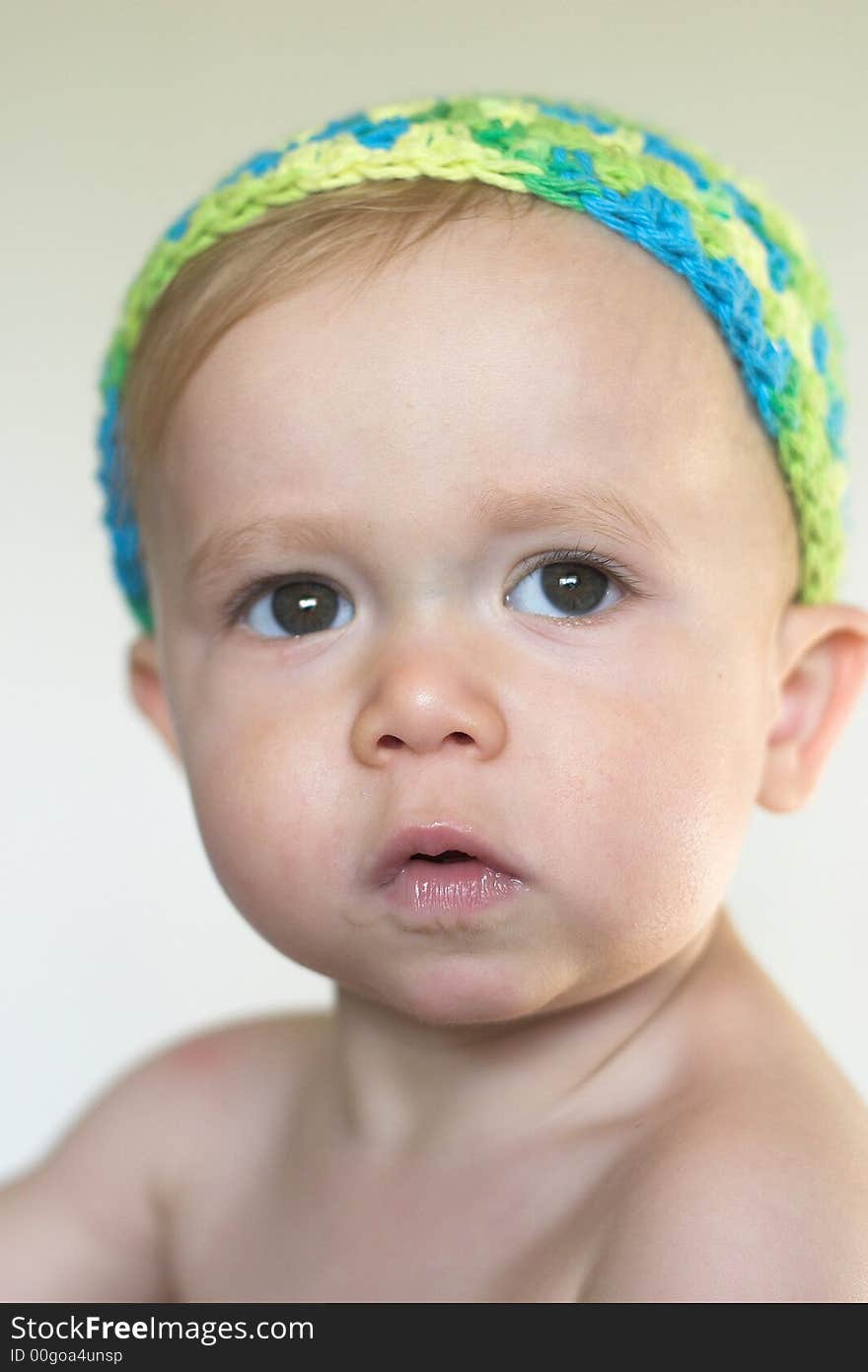 Image of beautiful toddler wearing a crochet cap