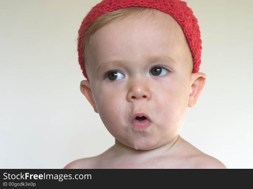 Image of beautiful toddler wearing a crochet cap