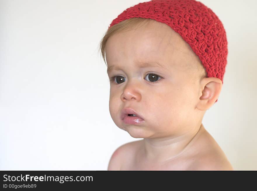 Image of beautiful toddler wearing a crochet cap