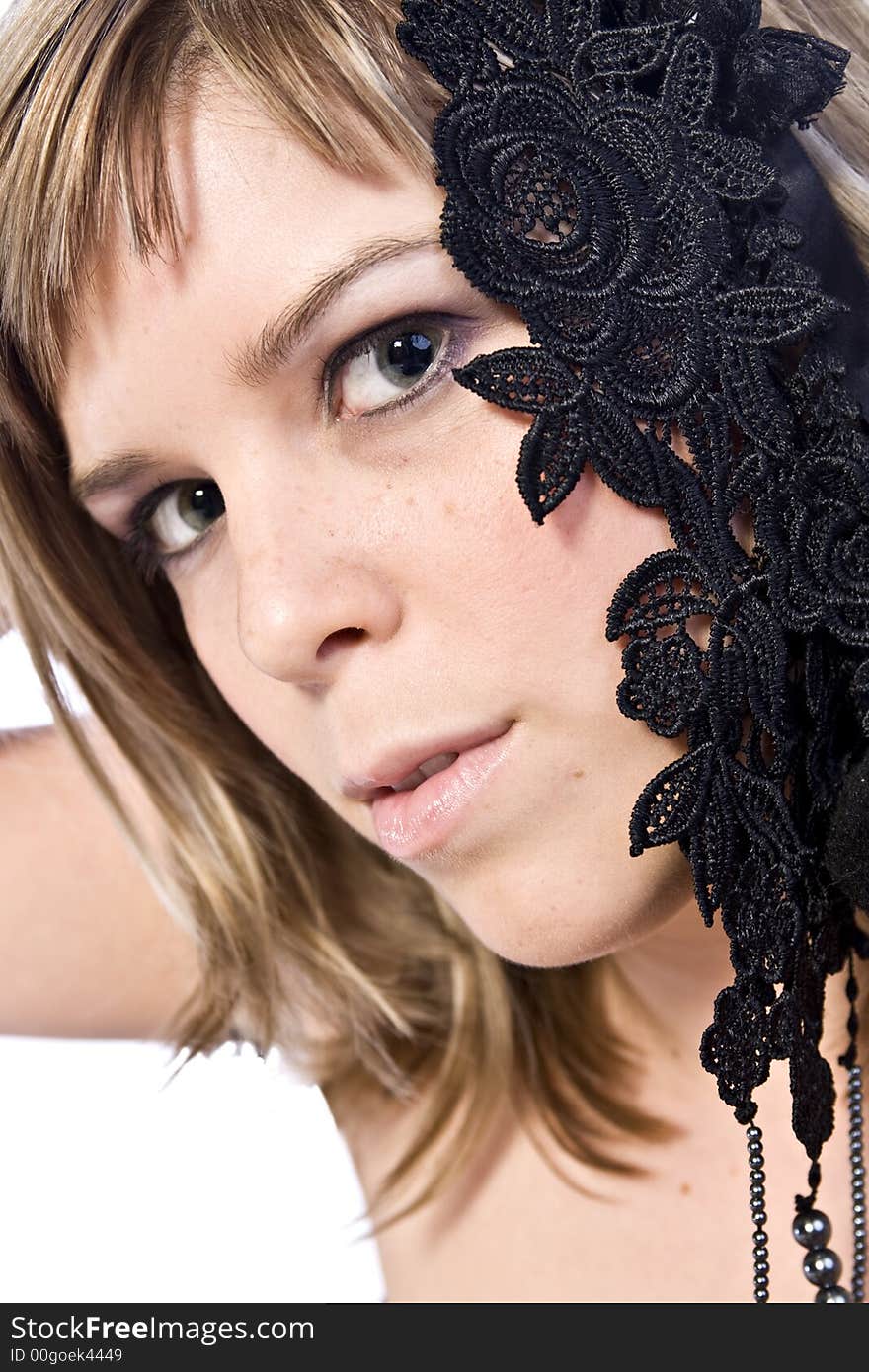 A young caucasian woman portrait taken in the studio on a white background. A young caucasian woman portrait taken in the studio on a white background