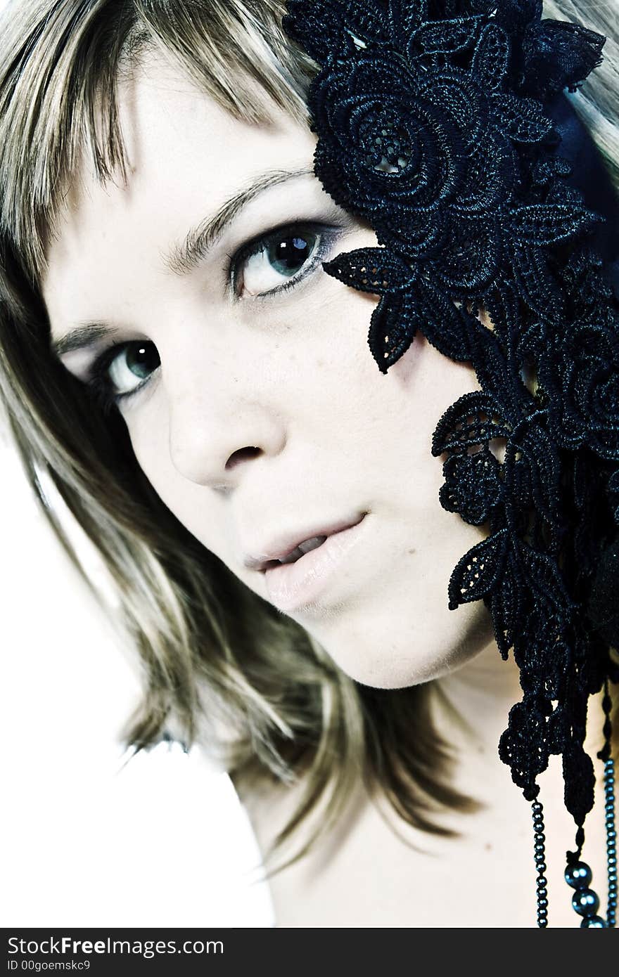 A young caucasian woman portrait taken in the studio on a white background. A young caucasian woman portrait taken in the studio on a white background