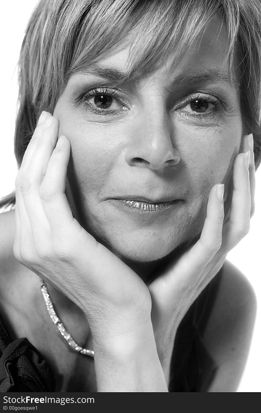 A adult caucasian woman portrait taken in the studio on a white background. A adult caucasian woman portrait taken in the studio on a white background